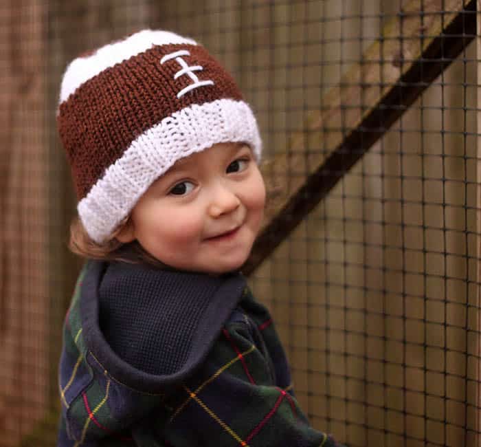 Football Baby Hat Free Knitting Pattern by blogger Gina Michele